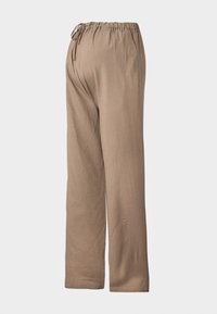 Pantalons de couleur brun clair, à coupe ample avec une taille élastique et un lien réglable, fabriqués en tissu doux, affichant un design à jambes droites.