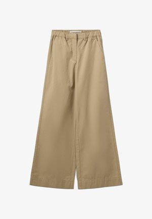 Béžové nohavice s širokými nohavicami a elastickým pásom, vybavené bočnými vreckami a hladkým, ľahkým bavlneným materiálom.