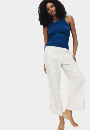 Blauwe tanktop gecombineerd met witte gestreepte wijde broek, zachte stof, casual ontwerp, elastische tailleband en geen zichtbare hardware.