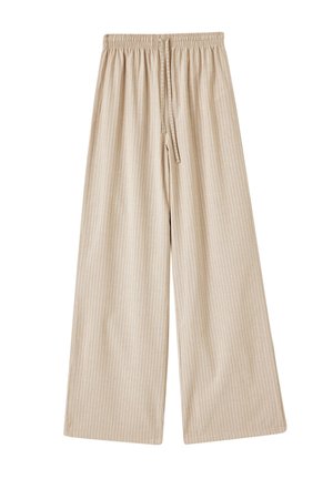 Pantalons larges beige avec une taille élastique et un cordon de serrage, dotés de rayures verticales blanches et d'une texture de tissu lisse.