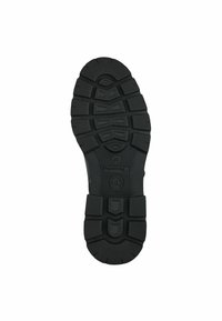 Suela de zapato de goma negra con una superficie texturizada, que presenta patrones de agarre y secciones elevadas para tracción y durabilidad.