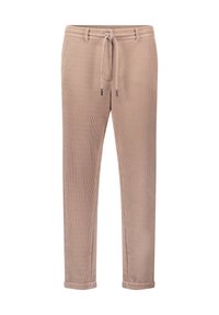 Beżowe spodnie z kordurowego materiału z elastycznym paskiem, zwężanymi nogawkami i podwiniętymi mankietami; mają poziome prążkowanie oraz subtelne metaliczne akcenty.