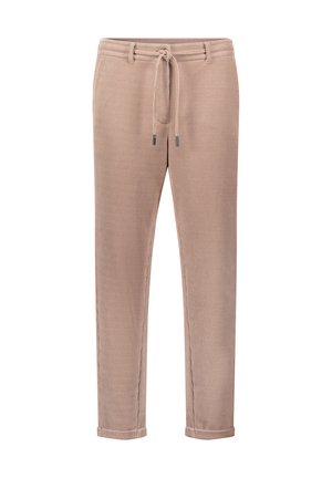 Beżowe spodnie z kordurowego materiału z elastycznym paskiem, zwężanymi nogawkami i podwiniętymi mankietami; mają poziome prążkowanie oraz subtelne metaliczne akcenty.