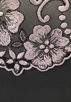 Black fabric with intricate lilac floral embroidery. Features detailed patterns and textures, blending smooth and raised stitching.