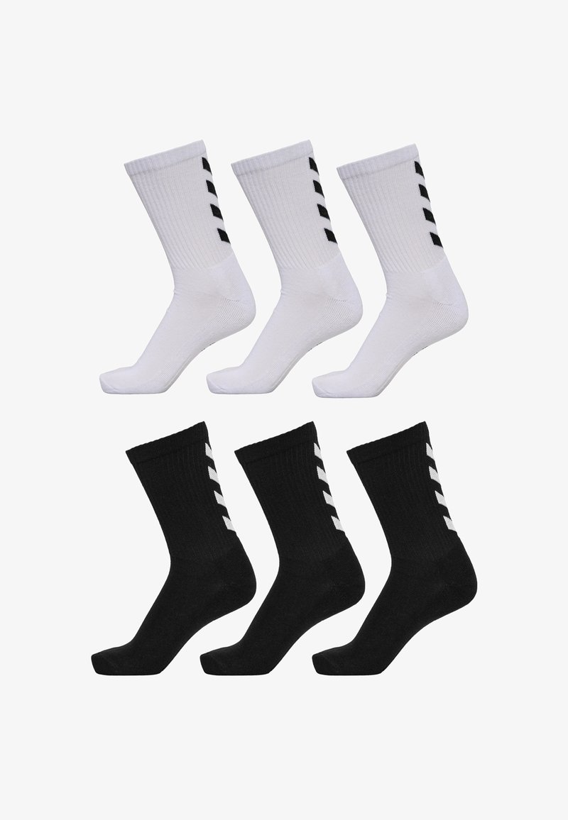 Pack of six ankle socks: three white with black stripes and three black with white stripes. Ribbed texture, standard athletic shape.