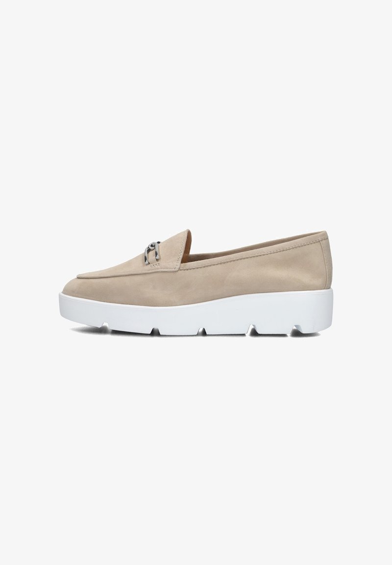 Beige suede slip-on shoe with a rounded toe, featuring a small silver hardware accent, and a chunky white rubber sole with visible tread.