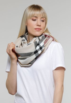 Beige ruudullinen äärettömyyskaulahuivi, jossa mustia, valkoisia ja punaisia yksityiskohtia, valmistettu pehmeästä kankaasta, aseteltuna löysästi kaulan ympärille.