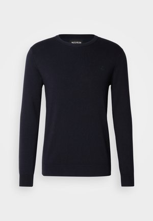 Dunkelblauer Baumwollpullover mit langen Ärmeln, Rundhalsausschnitt und gerippten Bündchen. Mit einem kleinen Logo, das auf der Brust gestickt ist.