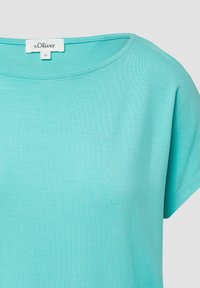 Lichtturquoise kortemouwen t-shirt met ronde halslijn en s.Oliver merklabel binnenin de kraag, maat 36.