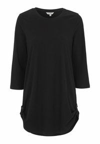 Zwarte lange mouw top met een ronde halslijn en twee zijknopen. Zacht materiaal, relaxte pasvorm en een gebogen zoom.