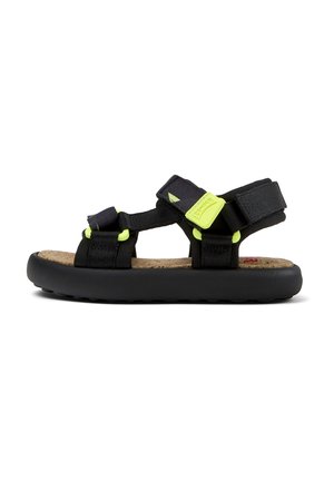 Svarta sandaler med neongröna detaljer och justerbara remmar, korkfot säng och strukturerad svart gummisula för grepp.
