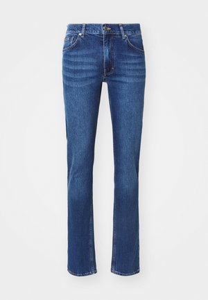 Jeans din denim albastru închis cu un design drept, având un ușor efect de decolorare, cinci buzunare și închidere cu nasture. Accente de cusătură neutră.