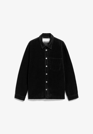 Zwarte corduroy blouse met een knoopsluiting aan de voorkant, een kraag, lange mouwen en een enkele borstzak. Voorzien van zichtbare zilveren knopen en een gestructureerde stof.
