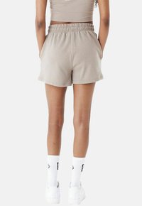 New Era Jogginghose - brown