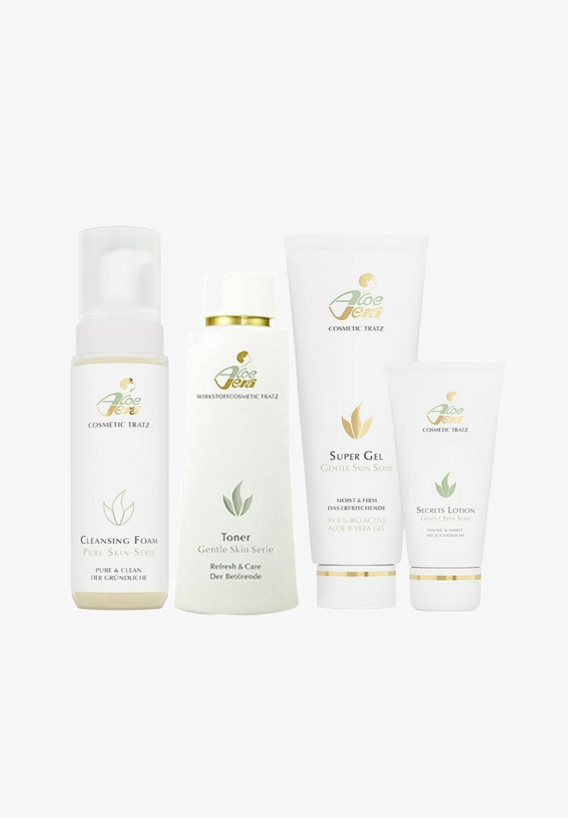 Four white skincare bottles with green accents: cleansing foam, toner, super gel, and secrets lotion, all featuring aloe vera branding.