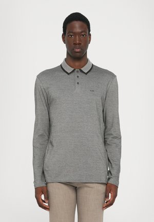 Long-sleeve gray polo shirt with striped black and white collar, featuring three buttons and a small logo on the chest. Simple, textured fabric.