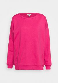 Sudadera de manga larga rosa hecha de un suave tejido texturizado. Presenta un cuello redondo, un ajuste relajado y puños y dobladillo de canalé.