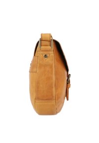 Tan leather shoulder bag with a smooth texture, adjustable strap, and metal accents; features a rounded shape and visible stitching details.