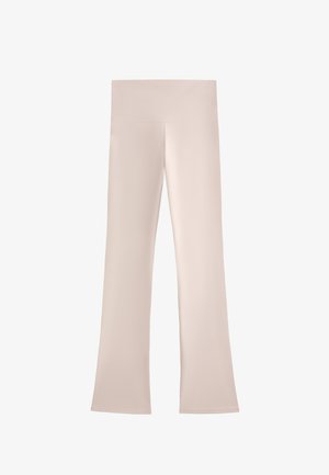 Lichtbeige flared broeken met een brede, gladde tailleband. Gemaakt van een zachte, rekbare stof, met een strakke, minimalistische uitstraling.