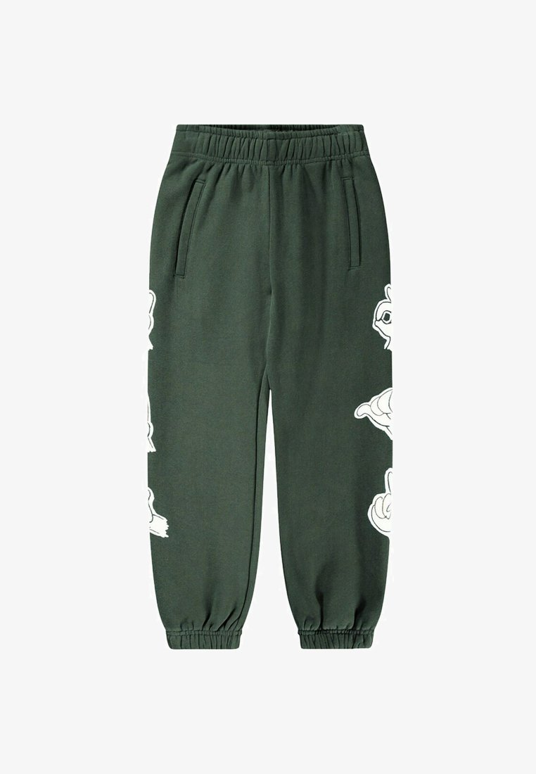 Donkergroene joggingsbroeken gemaakt van zacht materiaal, met een elastische tailleband en witte bloemensymbolen aan de zijkanten. Elastische boorden bij de enkels.