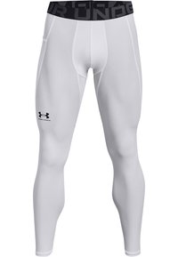 Białe legginsy kompresyjne z czarnym elastycznym paskiem w talii z napisem "Under Armour". Wykonane z gładkiego, rozciągliwego materiału, w dopasowanym kroju.