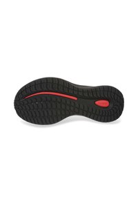 Black rubber shoe sole with a textured tread pattern and a central red accent line. Features curvature for ergonomic support.