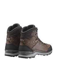 Braune Leder-Wanderschuhe mit hohem Knöcheldesign, verstärkten Zehenkappen und strukturierten Gummisohlen. Ausgestattet mit Metallösen und gepolstertem Schaft.