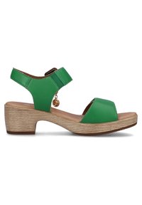Green leather sandal with two wide straps, adjustable ankle strap, and a low wooden-look heel. Features a decorative charm on the side.