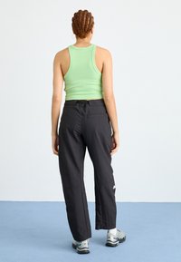 The North Face ABUKUMA LOOSE PANT - Hlače - black