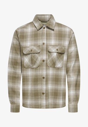 Een geruite flanellen shirt in bruin en wit, met een knoopsluiting aan de voorkant, twee borstzakken en lange mouwen met knoopmanchetten.