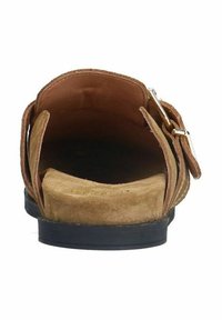 Brown suede sandal with a flat black sole, featuring an adjustable strap and a soft interior lining. Open back design for easy wear.