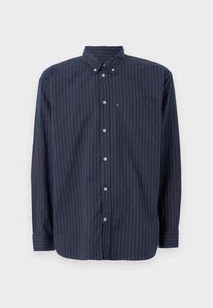 Sötétkék gombos ing függőleges csíkokkal, hosszú ujjakkal, gallérral és mellzsebbel. Texturált anyagból készült, kontrasztos gombokkal.