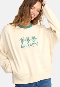 Cremfarbener Sweatshirt mit tealfarbenem Kragen und Palmbaum-Logo. Verfügt über überschnittene Schultern und einen lässigen Schnitt. Weiches Baumwollmischgewebe.