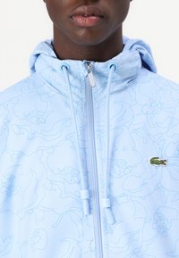 Lacoste Ľahká bunda - light bleu