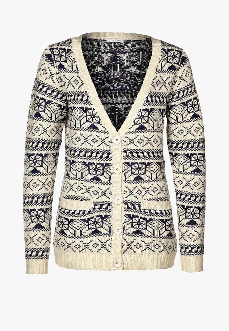 Cardigan à motifs beige et marine avec un col en V, des manches longues, quatre boutons sur le devant et deux poches frontales. Tissu en maille texturée.