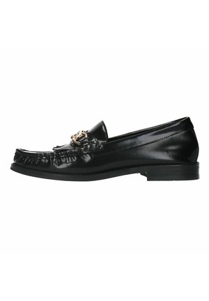 Black leather loafer with a rounded toe, decorative gold hardware, fringed detailing along the vamp, and a low, flat heel.