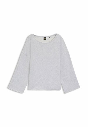 Ljusgrå långärmad sweatshirt med bred halsringning, droppade axlar och råkantad nederkant. Tillverkad av mjukt, texturerat tyg.