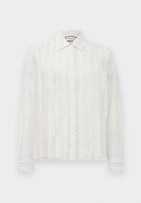 Balta ilgomis rankovėmis palaidinė su nėrinių vertikaliomis juostelėmis, mygtukais priekyje, smailiu apykakle ir nėrinių apdaila ant rankogalių.