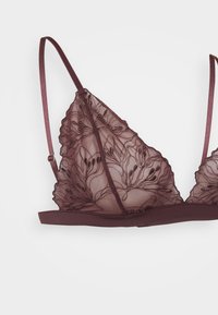 Burgundy bralette, jossa on läpinäkyvät pitsikupit kukkakirjailulla ja laineilevilla reunoilla. Pehmeä vyötärönauha ja säädettävät olkaimet mukavuutta varten.