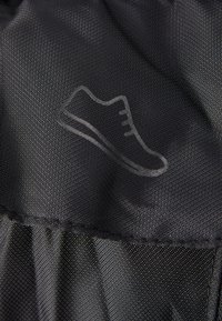 Black fabric with a smooth texture featuring a subtle, embossed shoe outline. The stitching is clean, with no visible hardware or accents.