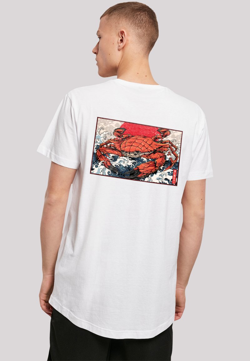 White t-shirt featuring a colorful crab graphic on the back, set against a red and blue wave-patterned background within a rectangular border.