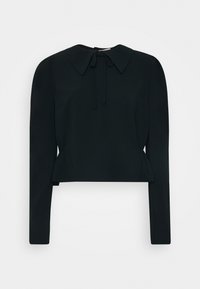 Top corto nero con maniche lunghe, colletto arrotondato e dettaglio di nodo frontale. Tessuto liscio con una leggera lucentezza, design minimalista.