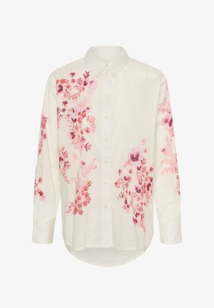 Wit overhemd met lange mouwen en knopen, met een spitse kraag, voorzien van roze en rode bloemmotieven op de mouwen en voorkant.