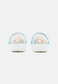 White clogs with a blue rim, featuring a smooth texture and decorative light blue abstract patterns on the sides. Open heel design.