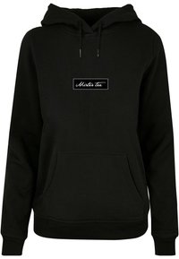 Black hooded sweatshirt made of soft fabric, featuring a front kangaroo pocket and a white rectangular logo in script on the chest.