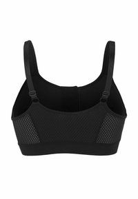 Zwarte sportbeha met ademende meshpanelen, verstelbare banden en een gladde textuur. Ontworpen voor comfort en ondersteuning tijdens actieve kleding.