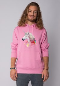 Roze hoodie met een eenhoornafbeelding, bliksemschicht en regenboogmanen. Inclusief een voorzak en een trekkoord kap.