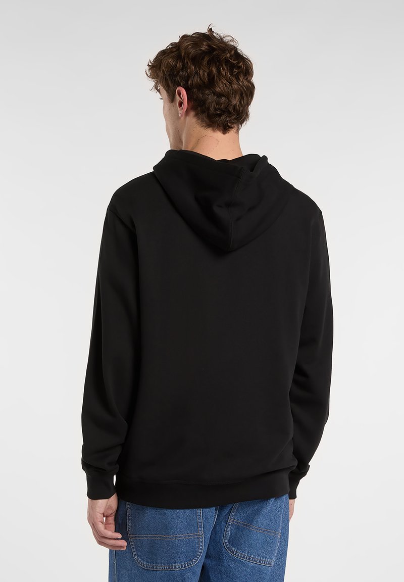 Felpa nera in tessuto morbido, con vestibilità rilassata e cappuccio con coulisse. Sul retro presenta un design minimalista con polsini a coste.