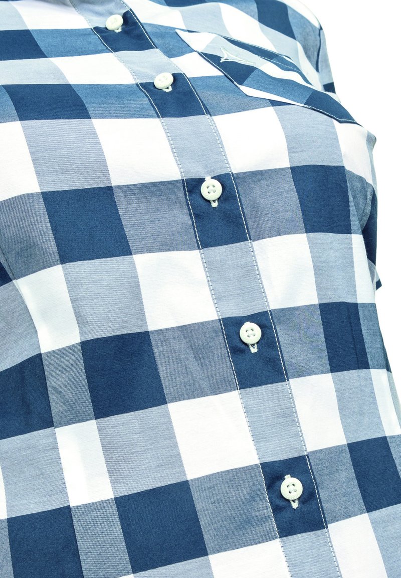 Modrá a bílá kostkovaná košile vyrobená z bavlny, s knoflíkovou přední částí, čtyřmi knoflíky a vyšitým kapsou na levé straně.