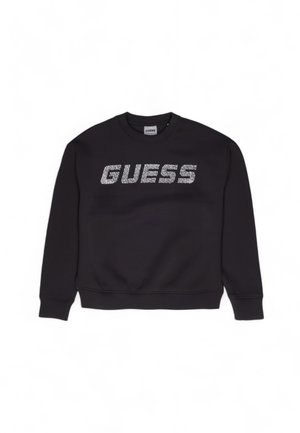 Sort sweatshirt med ribbede ærmer og kant, udstyret med et stort sølvglitrende "GUESS" logo på tværs af brystet. Materiale i bomuldsblanding.